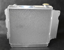 Load image into Gallery viewer, GPI 3 ROW Aluminum Racing Radiator & Shroud fan for 1987-2006 Jeep Wrangler YJ/TJ 2.4L-4.2L 1987 1988 1989 1990 1991 1992 1993 1994 1995 1996 1997 1998 1999 2000 2001 2002 2003 2004 2005 2006